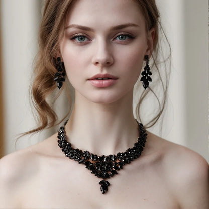 Elegant black leaves jewelry set by MC THE BLACK DIAMOND with crystal rhinestone necklace and earrings for bridal or boho wedding look.