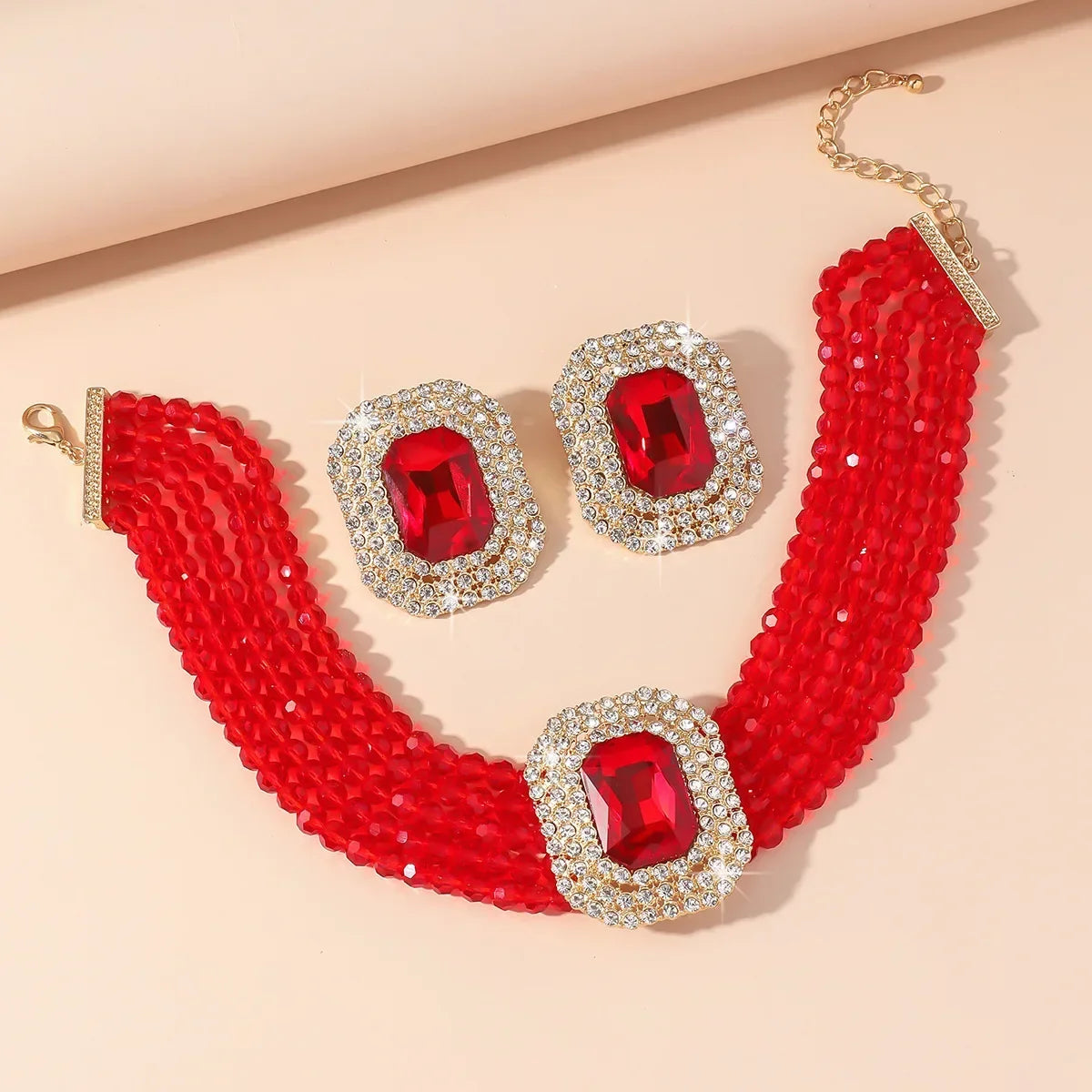 MC THE BLACK DIAMOND jewelry set featuring multilayer champagne red white black crystal necklace and geometric square earrings for women.