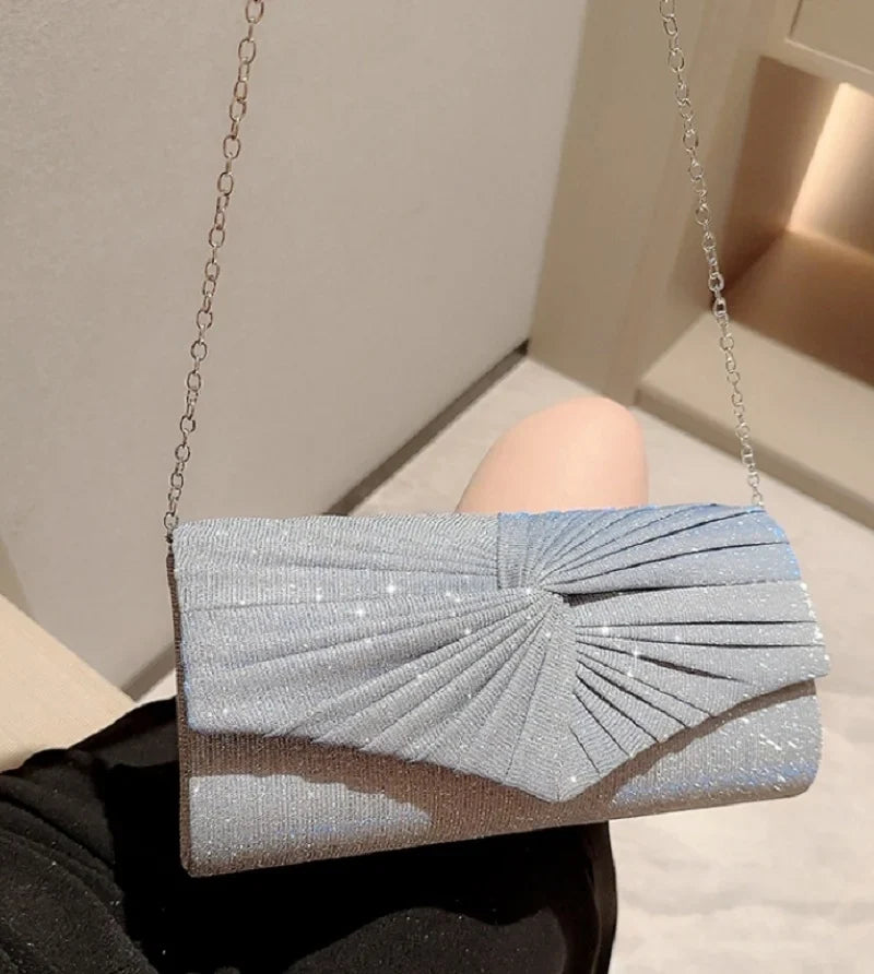Luxury silver ladies dinner handbag from Mohammad Collection featuring shining evening clutch style with crossbody strap.