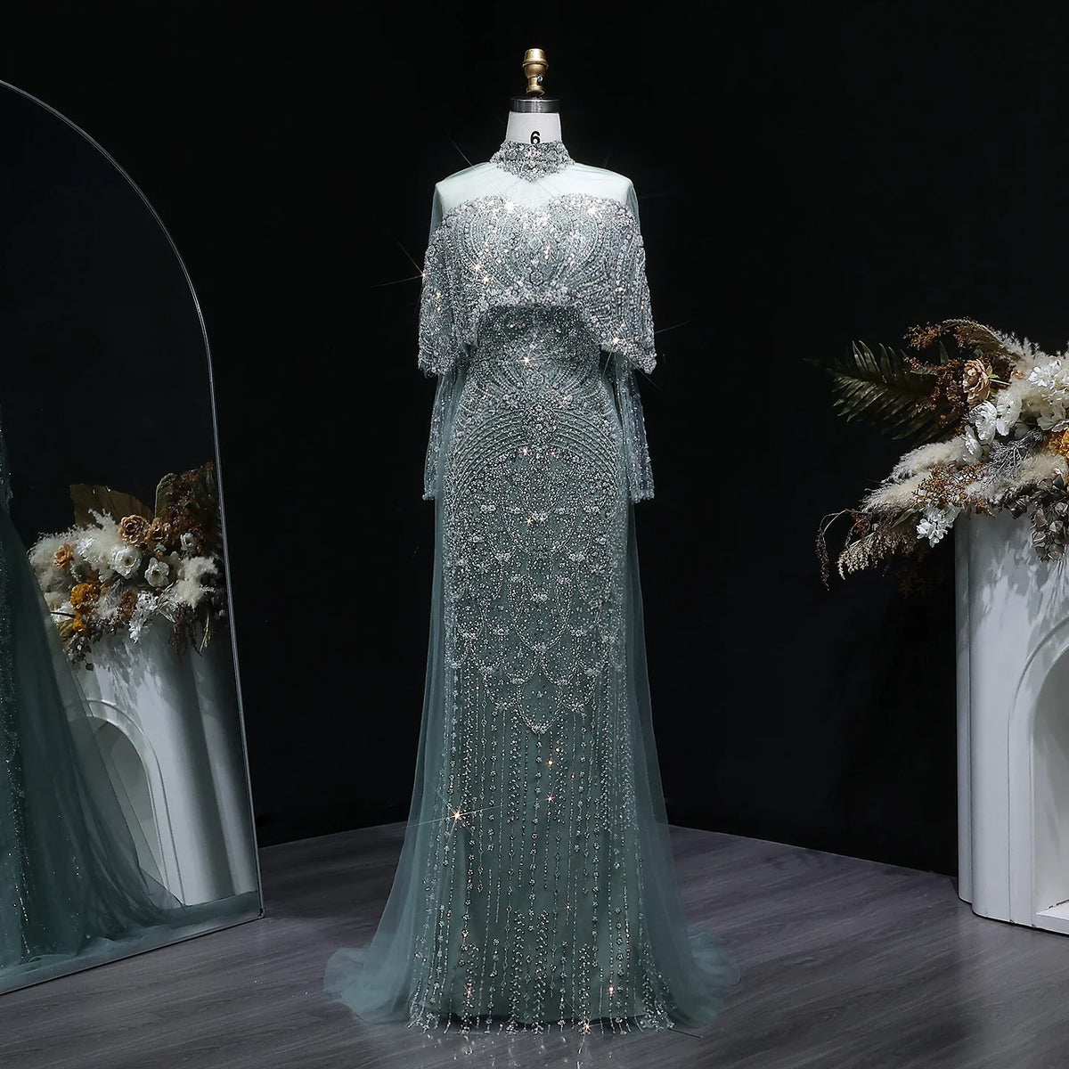 Beaded grey Arabic evening dress by MC THE BLACK DIAMOND featuring intricate beadwork and elegant design.