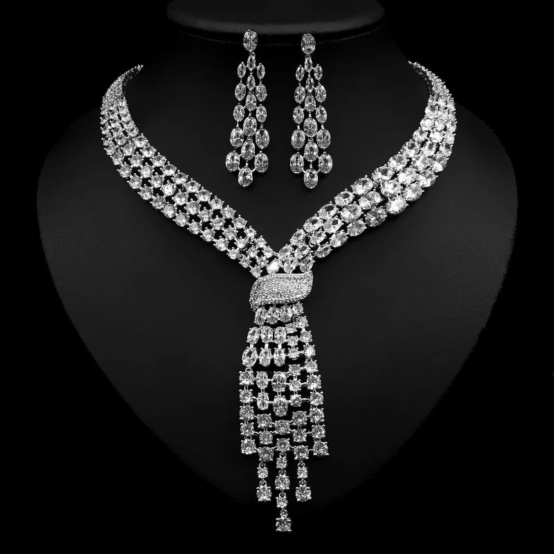 Handmade lab emerald and diamond jewelry set by MC THE BLACK DIAMOND, includes wedding rings, earrings, and necklace in 14K white gold.