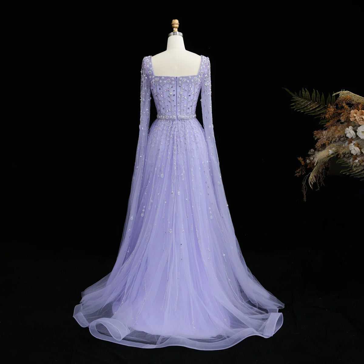 Elegant pink Dubai evening dress by MC THE BLACK DIAMOND featuring intricate details and a flowing silhouette.