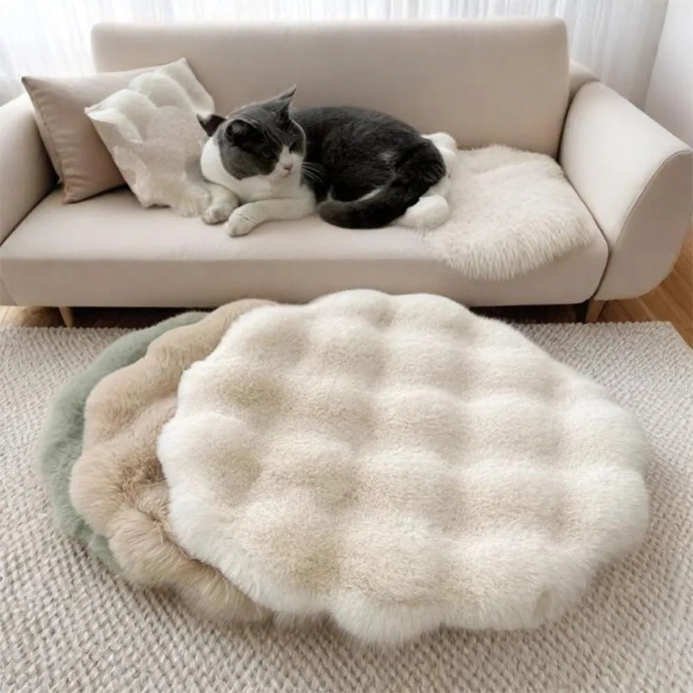 Round washable cat and dog pet cushion bed with non-slip bottom, insulated pillow-style sleeping pad by MC THE BLACK DIAMOND.