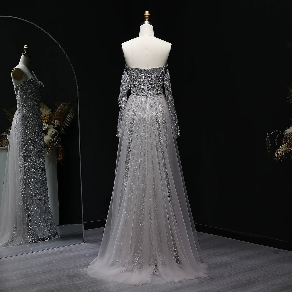 Beaded grey Arabic evening dress by MC THE BLACK DIAMOND featuring intricate beading and elegant design for formal occasions.