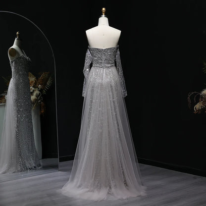 Beaded grey Arabic evening dress by MC THE BLACK DIAMOND featuring intricate beading and elegant design for formal occasions.
