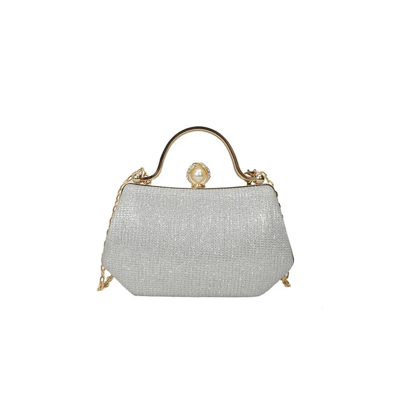 Black MC The Black Diamonds evening hand bag with a chain strap and simple crossbody style, showcasing its elegant, solid color design.