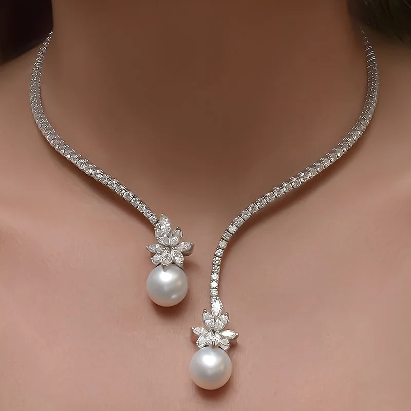 Elegant vintage-inspired pearl and zirconia flower pendant necklace by 𝕄𝕔 𝕋𝕙𝕖 𝔹𝕝𝕒𝕔𝕜 𝔻𝕚𝕒𝕞𝕠