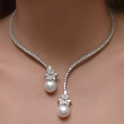 Elegant vintage-inspired pearl and zirconia flower pendant necklace by 𝕄𝕔 𝕋𝕙𝕖 𝔹𝕝𝕒𝕔𝕜 𝔻𝕚𝕒𝕞𝕠