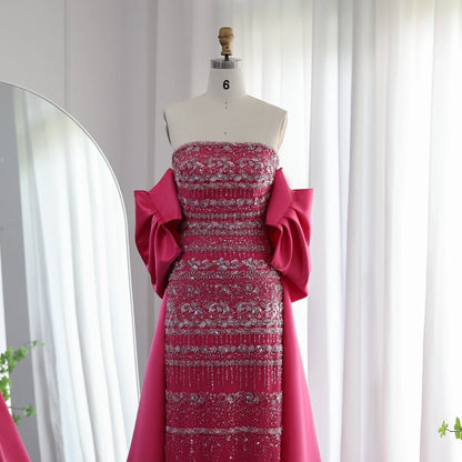 Elegant sage green evening dress by MC THE BLACK DIAMOND, featuring a flowing design and sophisticated style for formal occasions.