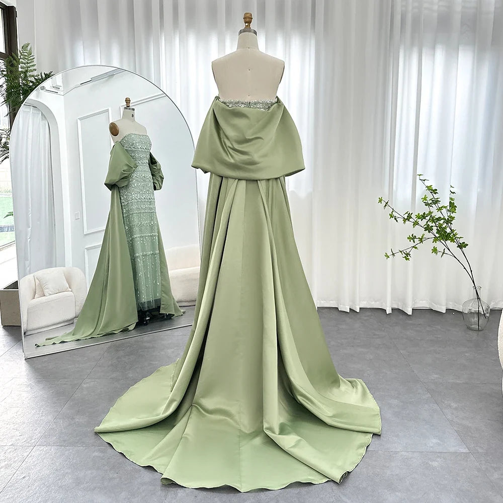 Sage green MC THE BLACK DIAMOND evening dress featuring elegant fabric and intricate detailing, perfect for formal occasions.