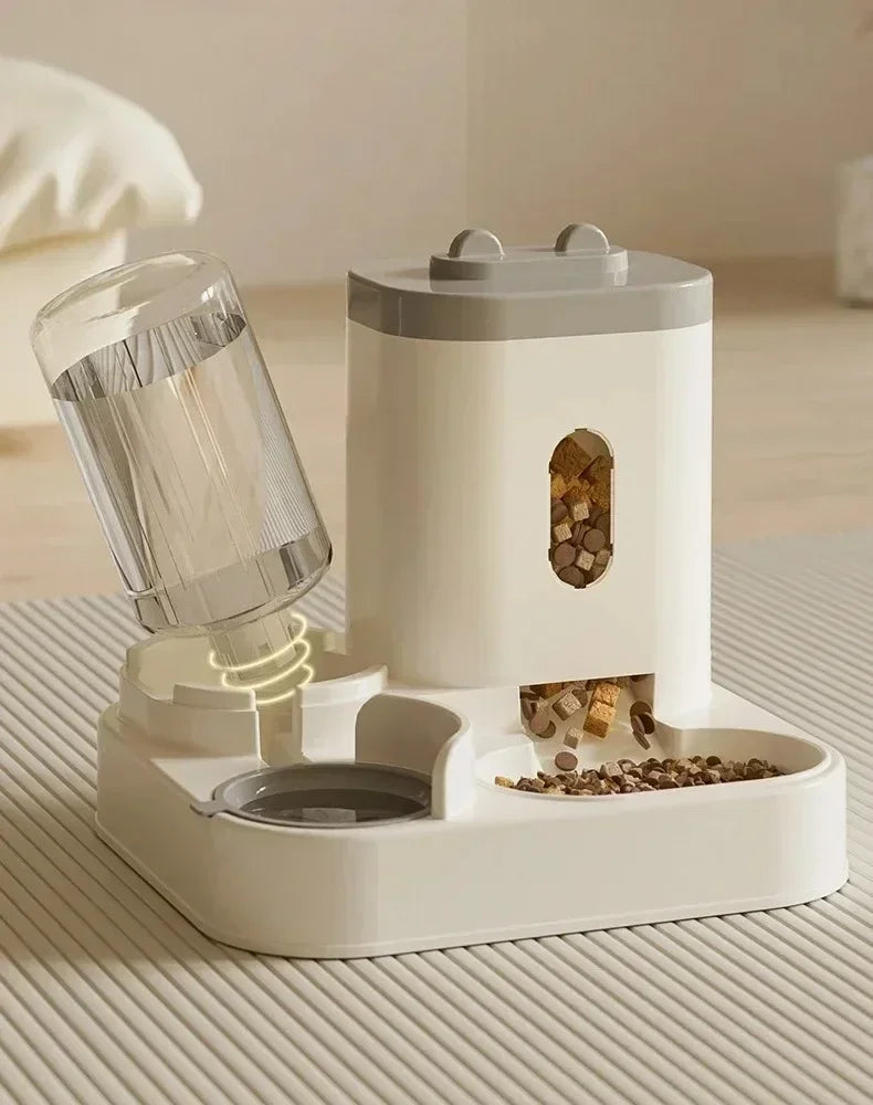 Automatic pet feeder with water fountain by MC THE BLACK DIAMOND, featuring a food bowl and water dispenser for pets.