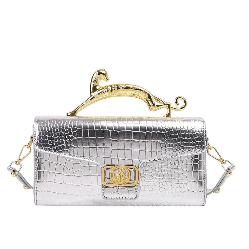 Women luxury leather shoulder bag by MC THE BLACK DIAMOND featuring a metal buckle and simple elegant design for fashionable parties.