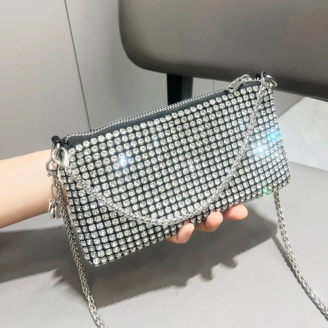 Luxury MC THE BLACK DIAMOND rhinestone clutch purse with handle, elegant women’s shoulder bag, embellished with sparkling rhinestones.