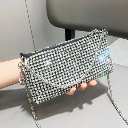 Luxury MC THE BLACK DIAMOND rhinestone clutch purse with handle, elegant women’s shoulder bag, embellished with sparkling rhinestones.