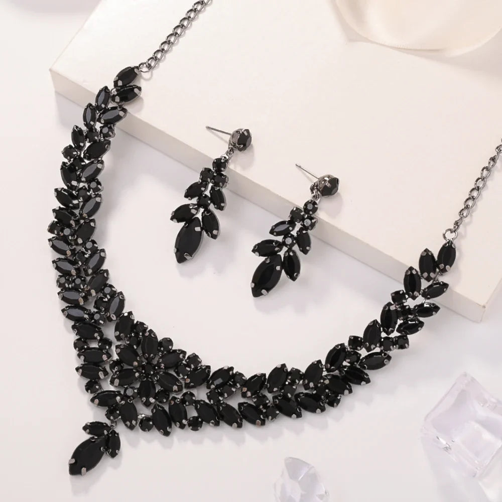Black leaves jewelry set by MC THE BLACK DIAMOND featuring crystal bridal necklace and earrings, boho design, handmade rhinestone accents.