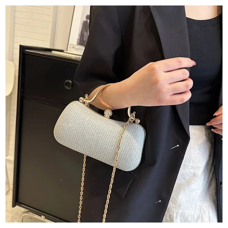 Black chain evening shoulder bag by MC THE BLACK DIAMOND, stylish hand bag for women suitable for dinner and formal occasions.