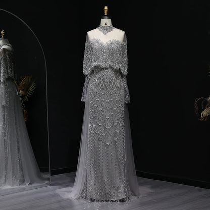 Beaded grey Arabic evening dress by MC THE BLACK DIAMOND featuring intricate beadwork and elegant design for formal occasions.