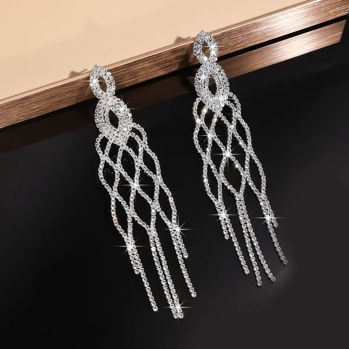 MC THE BLACK DIAMOND long tassel rhinestone drop earrings with hollow geometric design and crystal dangles for women.