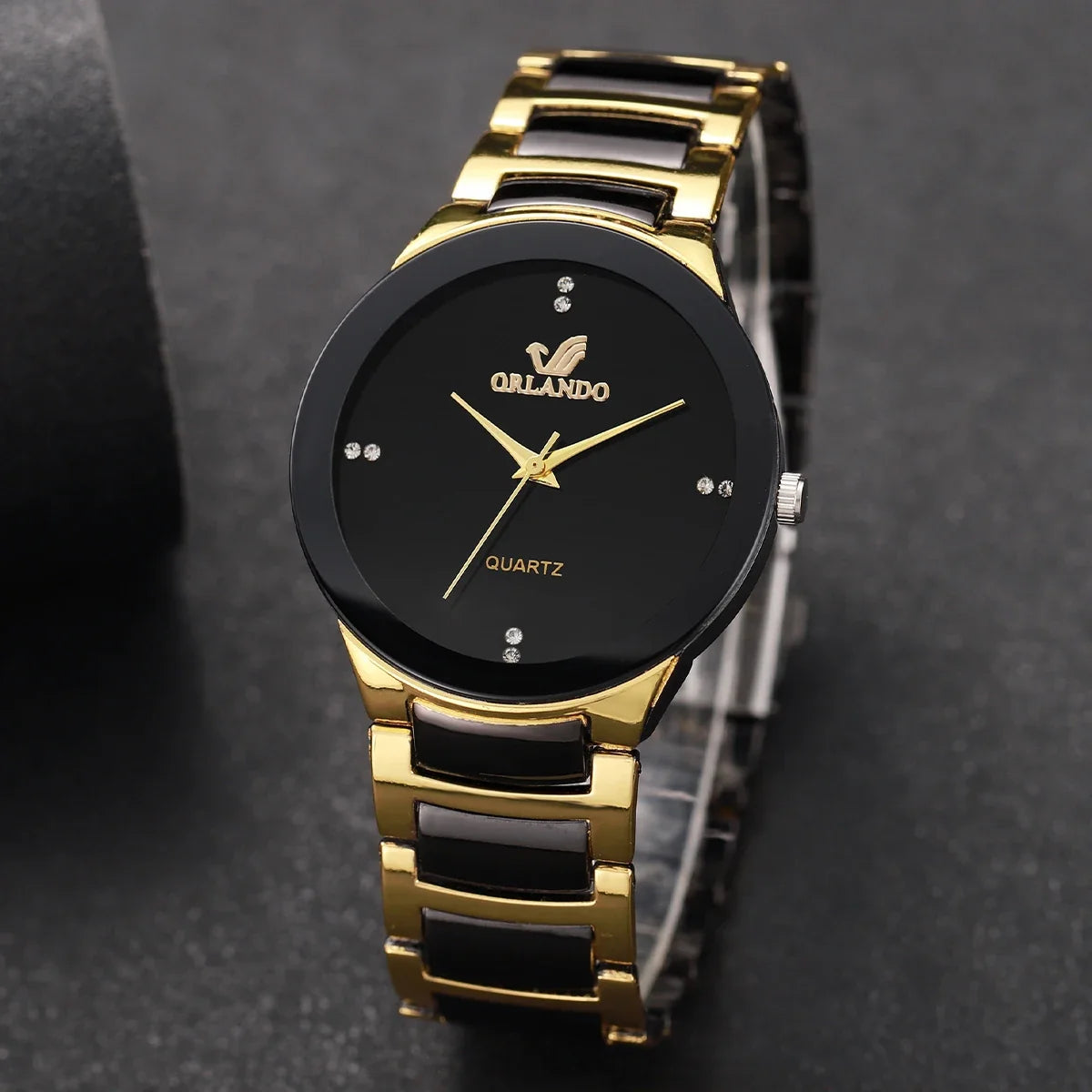 Pair of MC The Black Diamonds his and hers matching watches with black bands and diamond accents, displayed side by side.