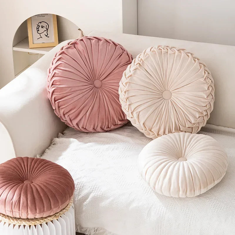 Pink round pumpkin-shaped cushion by MC THE BLACK DIAMOND, soft seat pillow for sofa and living room decor.