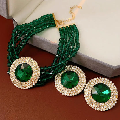 Green rhinestone jewelry set with necklace and earrings, featuring glass inlay and emerald accents, by MC THE BLACK DIAMOND