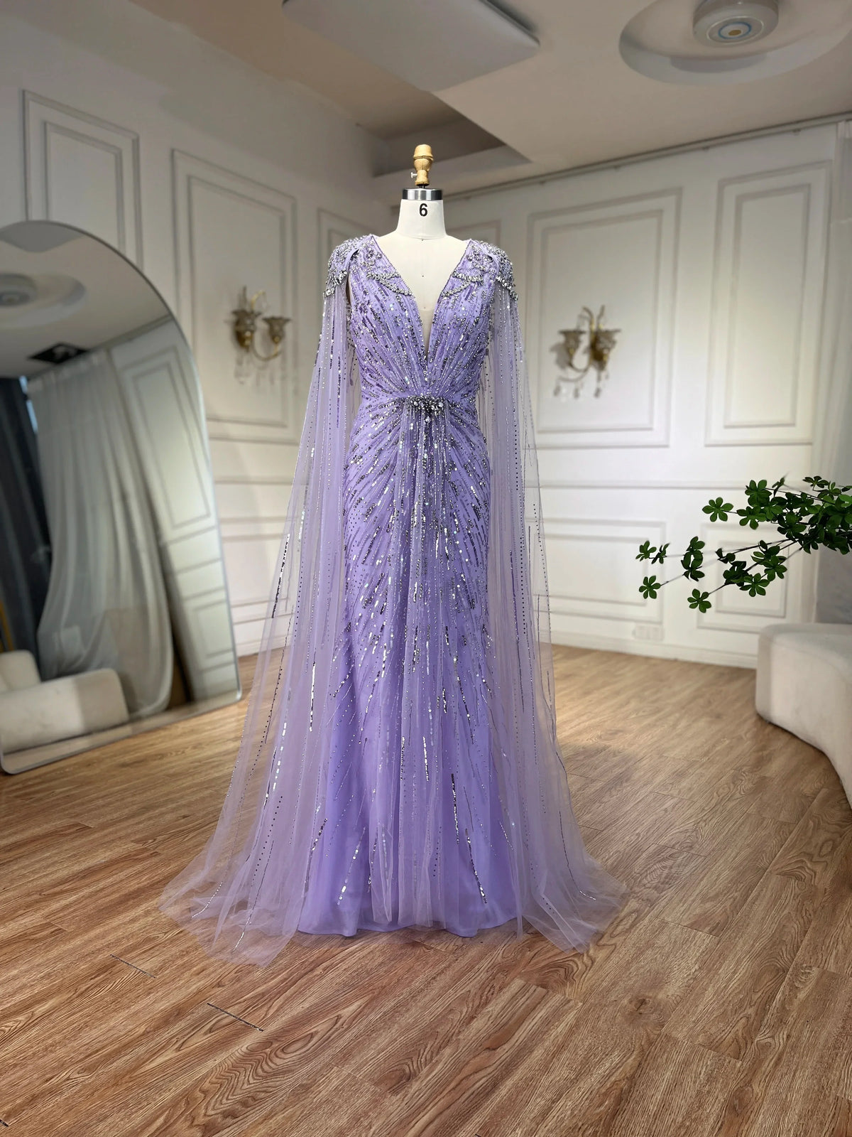 Turquoise mermaid evening dress by MC THE BLACK DIAMOND featuring elegant fit and flowing fabric, perfect for formal occasions.