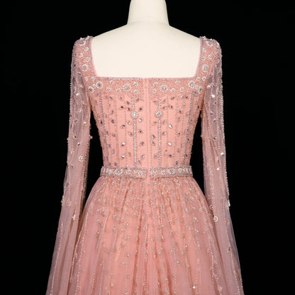 MC Luxury Pink Dubai Evening Dress by MC THE BLACK DIAMOND, elegant pink evening gown with intricate details and flowing fabric.