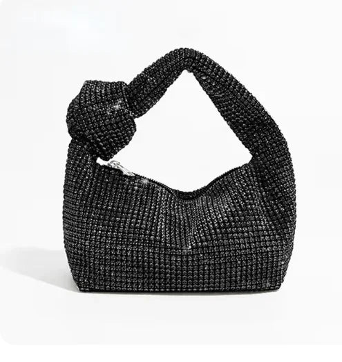 Silver handle evening bag with crystal rhinestone knot design by MC THE BLACK DIAMOND, featuring a top handle and luxurious tote style.