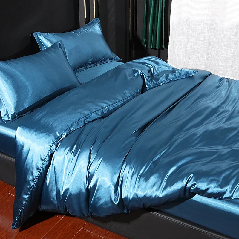 Luxury satin bedding set with fitted sheet and duvet cover by MC THE BLACK DIAMOND, showcasing smooth, elegant home decor.