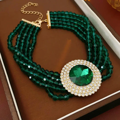 Green glass jewelry set with inlaid rhinestones, featuring a necklace and earrings, elegant wedding accessory by MC THE BLACK DIAMOND