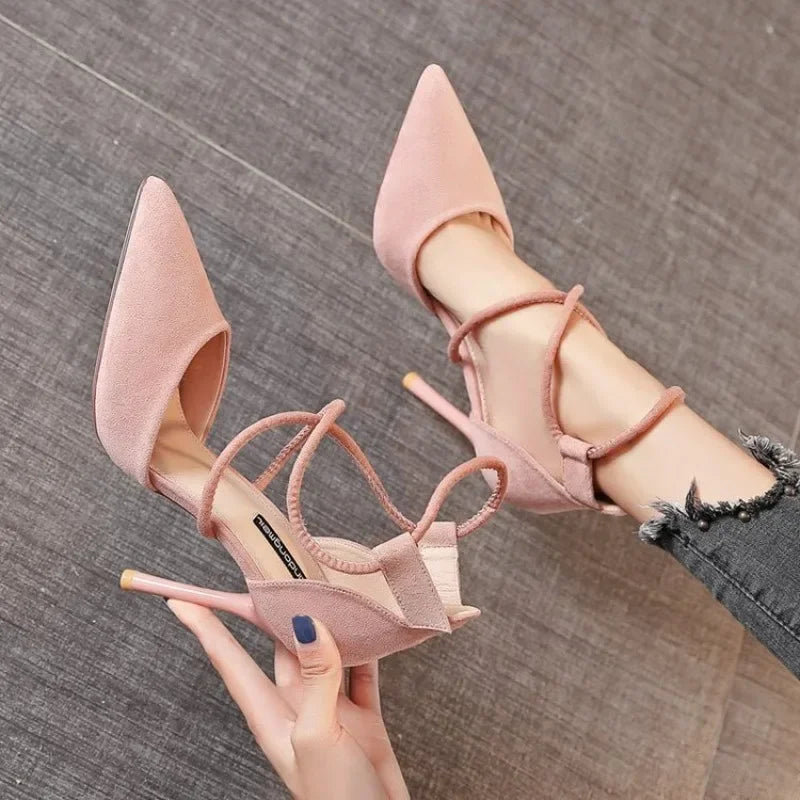 MC THE BLACK DIAMOND suede cross-strap Roman sandals with pointed toes, high heels, buckle detail, and elegant design.