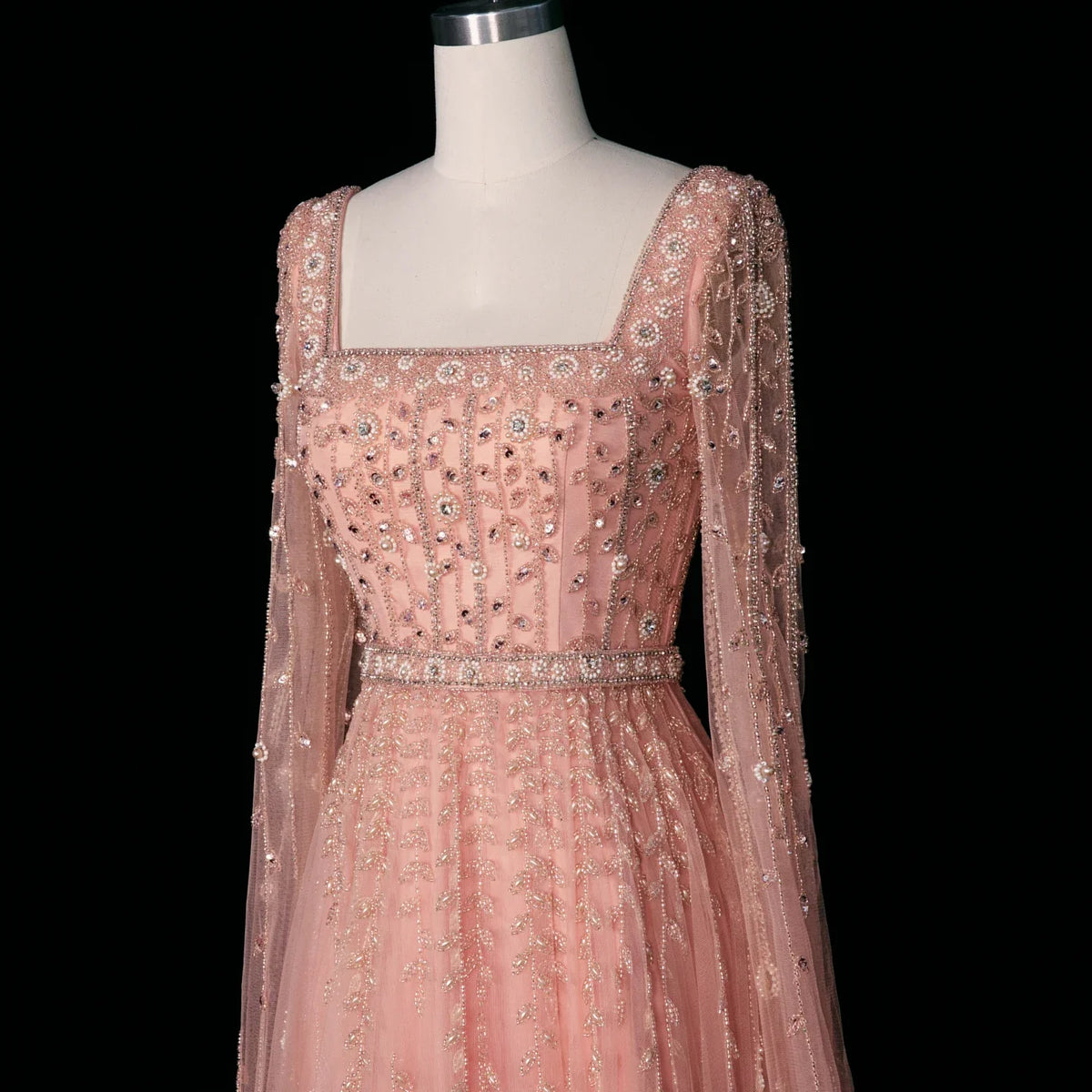 Elegant MC THE BLACK DIAMOND pink Dubai evening dress with intricate detailing and flowing fabric, perfect for formal occasions.