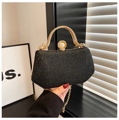 Black MC The Black Diamonds hand bag with solid color, chain strap, and simple crossbody design for versatile evening wear.