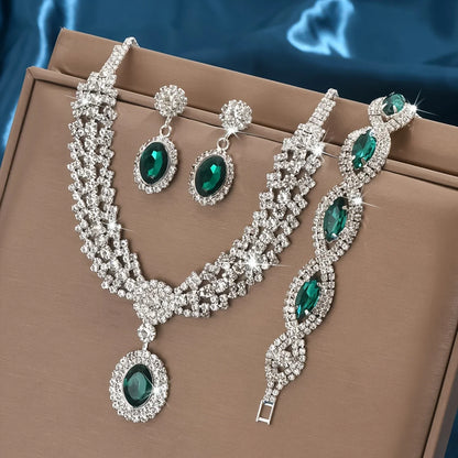 Elegant bridal jewelry set featuring a necklace and earrings with sparkling rhinestones by 𝕄𝕔 𝕋𝕙𝕖 𝔹𝕝𝕒𝕔𝕜 𝔻𝕚𝕒𝕞