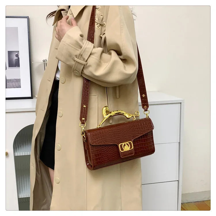 Women luxury leather shoulder bag by MC THE BLACK DIAMOND featuring a metal buckle and simple elegant design for stylish occasions.