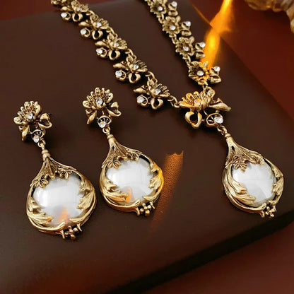 Vintage Mohammand Collection rhinestone jewelry set featuring a flower pendant pearl earrings and high-end retro bridal necklace