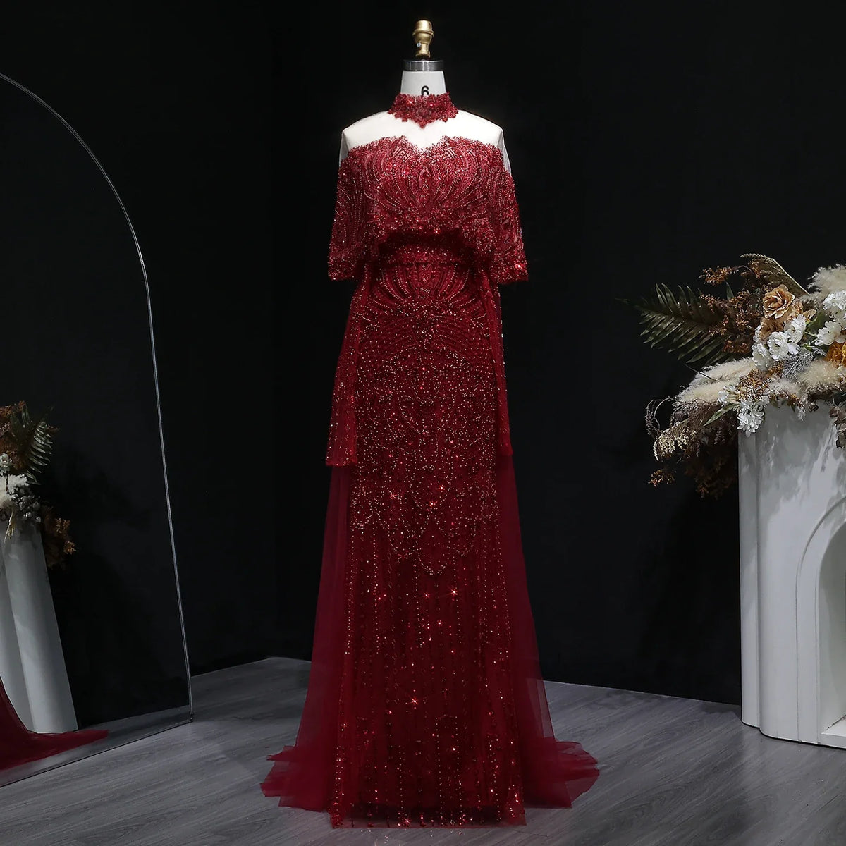 Elegant grey Arabic evening dress by MC THE BLACK DIAMOND, beaded details, flowing fabric, perfect for special occasions