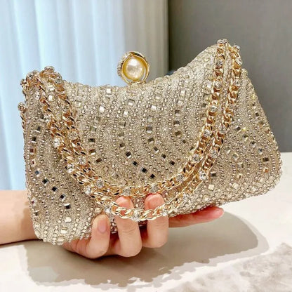 Luxury MC THE BLACK DIAMOND evening clutch bag with rhinestone diamond inlay, gold and silver finish, perfect for weddings and parties.