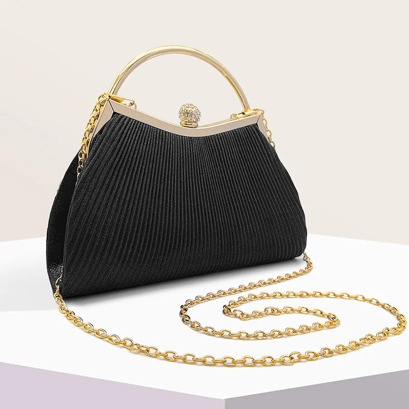 Gold MC THE BLACK DIAMOND pleated evening clutch handbag with glitter and diamond accents, top handle for wedding or party dress.