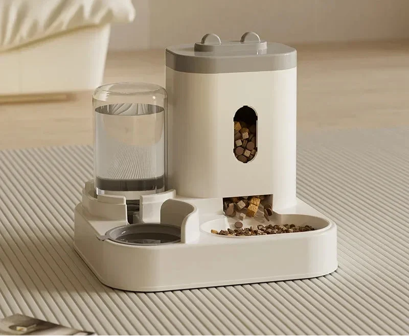 Automatic pet feeder with water fountain by MC THE BLACK DIAMOND, featuring a bowl and drinking water dispenser for pets.