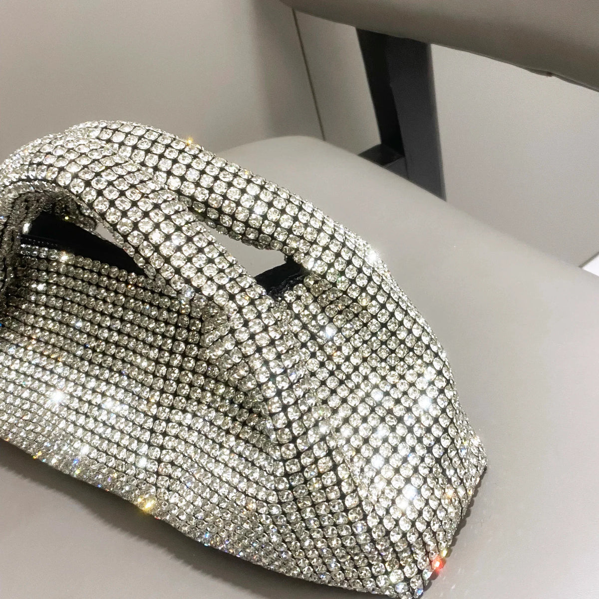 Shiny crystal clutch purse by MC THE BLACK DIAMOND, handmade rhinestone evening handbag with bucket shoulder style.