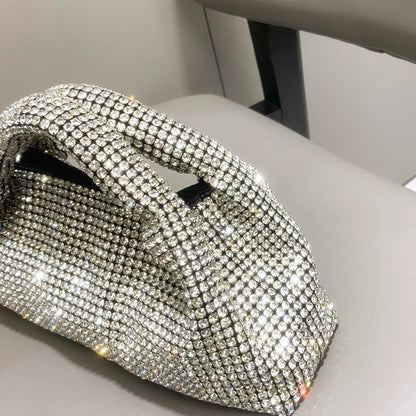 Shiny crystal clutch purse by MC THE BLACK DIAMOND, handmade rhinestone evening handbag with bucket shoulder style.