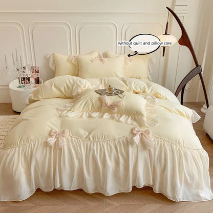 Set of three white bedding bed sheets with ruffle duvet cover from MC The Black Diamonds, showcasing soft, elegant fabric and ruffle details.