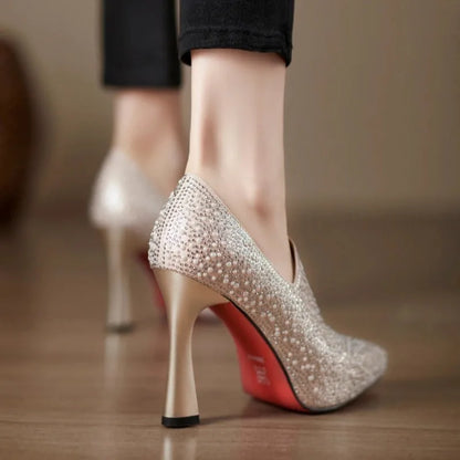 Rhinestone high heels by Mohamad Collection featuring a pointed toe, pearl accents, and crystal embellishments for bridal elegance.