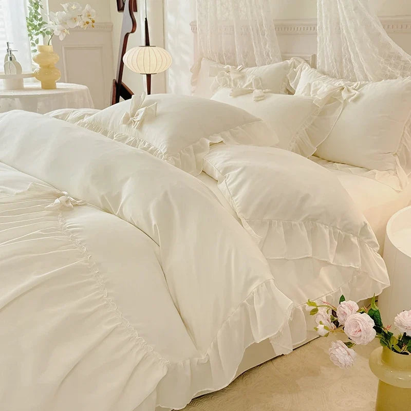 Three-piece white bedding set with ruffled duvet cover by 𝕄𝕋𝕙𝕖 𝔹𝕝𝕒𝕔𝕜 𝔻𝕚𝕒𝕞𝕠𝕟�