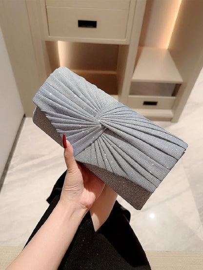 Elegant silver ladies evening clutch bag from Mohammad Collection, featuring a shining design, crossbody strap, and stylish wallet layout.