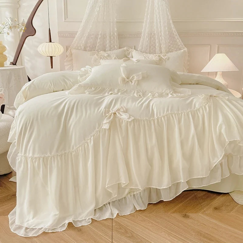 Three-piece white bedding set with ruffled duvet cover and bedsheets from 𝕄𝕔 𝕋𝕙𝕖 𝔹𝕝𝕒𝕔𝕜 𝔻𝕚𝕒𝕞