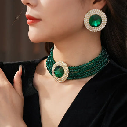 Green rhinestone jewelry set including necklace and earrings with glass round stones, elegant and luxurious for women.