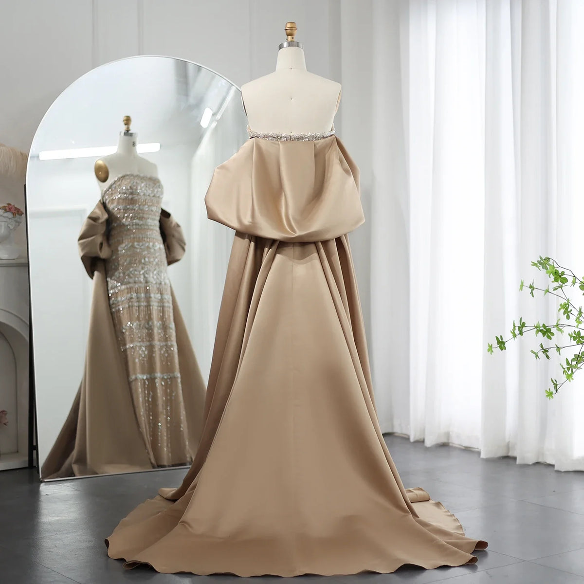 Sage green MC Luxury Dubai evening dress by MC THE BLACK DIAMOND, featuring elegant fabric and intricate design details.