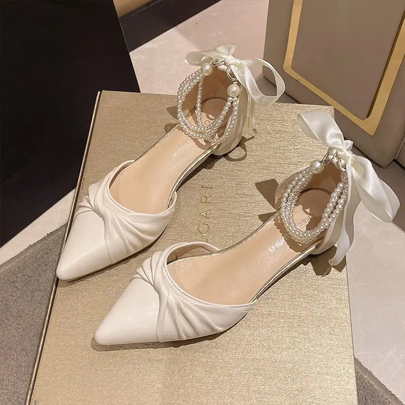 White fairy-style sandals for women with chunky heels, pearl accents, and unique summer design by MC THE BLACK DIAMOND.